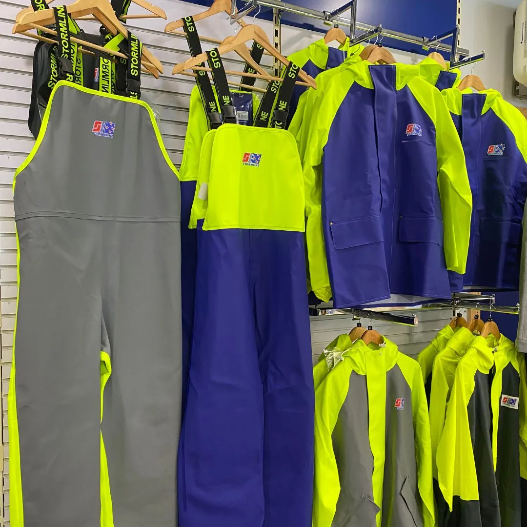 Display of various Stormline clothing items, including jackets, trousers, and vests, demonstrating the comprehensive range at SNG's Inshore Shop