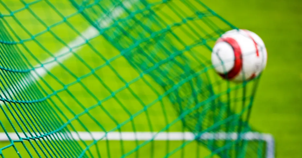 Goal post nets in action during a game, showcasing SNG Sports Nets' customisable coloured designs