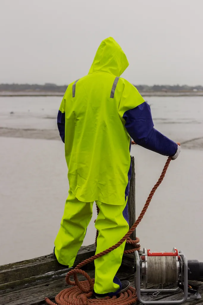 Worker wearing Stormline safety clothing while on a pier