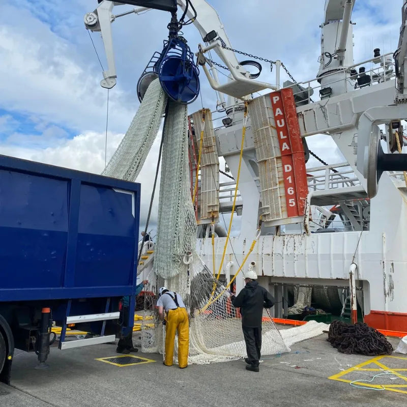 Crew loading SWAN 38 Mackerel/Scad Brailer onto FV Paula at the dock