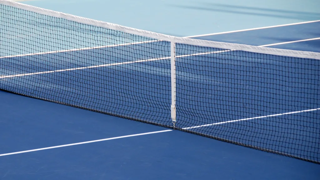 Close-up of a tennis net showing the durable mesh and reinforced headband designed for long-lasting use.