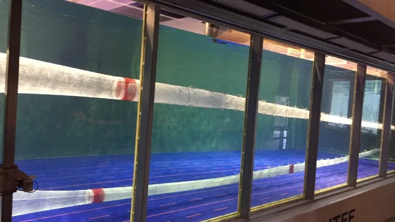 Close-up view of fishing net undergoing performance trials in a flume tank.